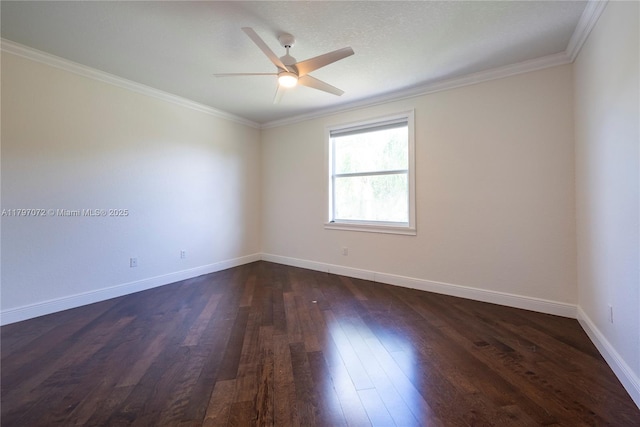 spare room with baseboards, crown molding, dark wood finished floors, and ceiling fan