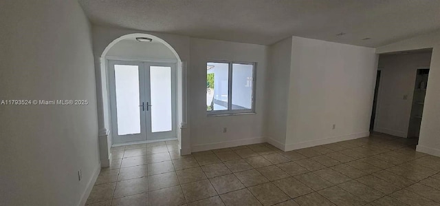 14661 SW 50th St, Miami, FL 33175 - empty room featuring tile patterned floors, french doors, and baseboards