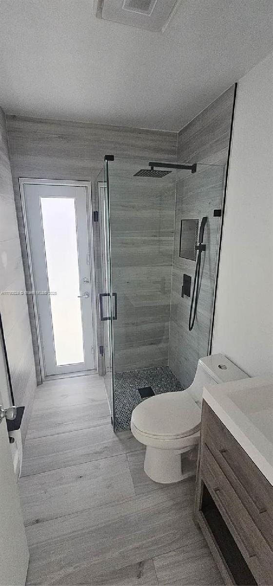 14661 SW 50th St, Miami, FL 33175 - full bath featuring vanity, toilet, a textured ceiling, and a shower stall