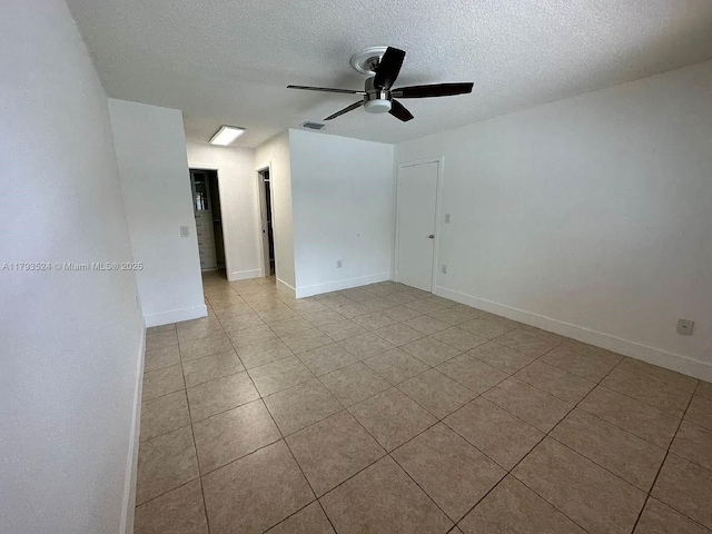 14661 SW 50th St, Miami, FL 33175 - empty room featuring light tile patterned floors, a textured ceiling, visible vents, baseboards, and ceiling fan