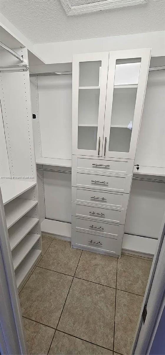 14661 SW 50th St, Miami, FL 33175 - spacious closet featuring tile patterned flooring