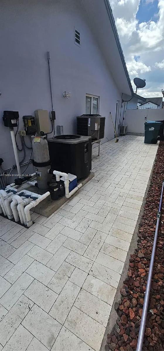 14661 SW 50th St, Miami, FL 33175 - view of patio with central AC and fence