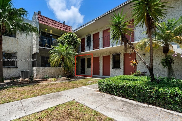 view of property with central AC unit