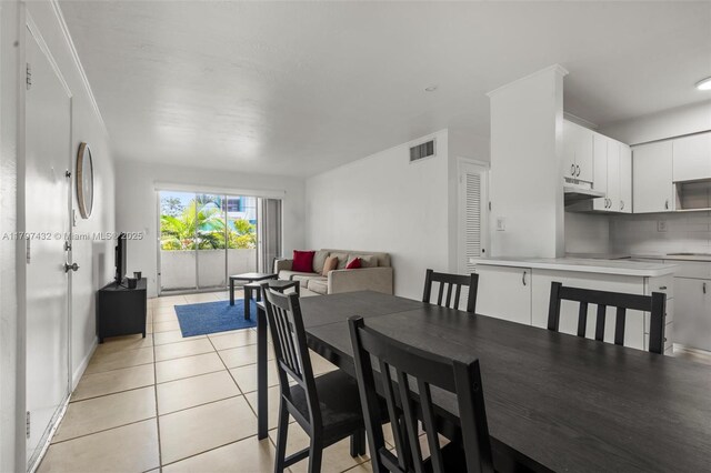 dining room with light tile patterned floors and visible vents