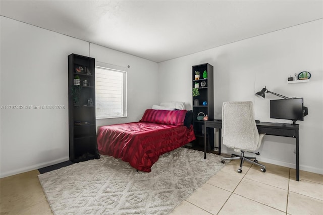 tiled bedroom with baseboards