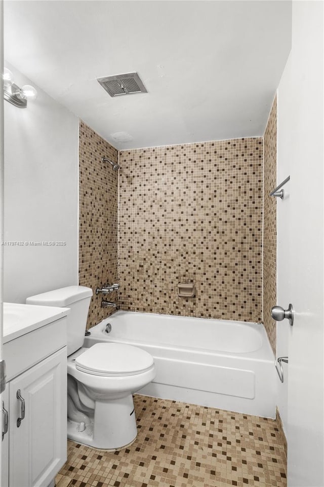 full bath featuring toilet, visible vents, vanity, and shower / washtub combination