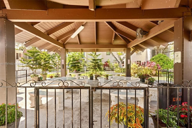 view of patio with a gate, a gazebo, and fence