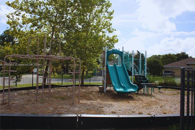 community jungle gym featuring fence