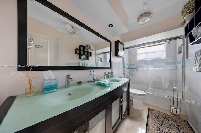1243 Funston St, Hollywood, FL 33019 - bathroom with a sink, toilet, bath / shower combo with glass door, a ceiling fan, and double vanity