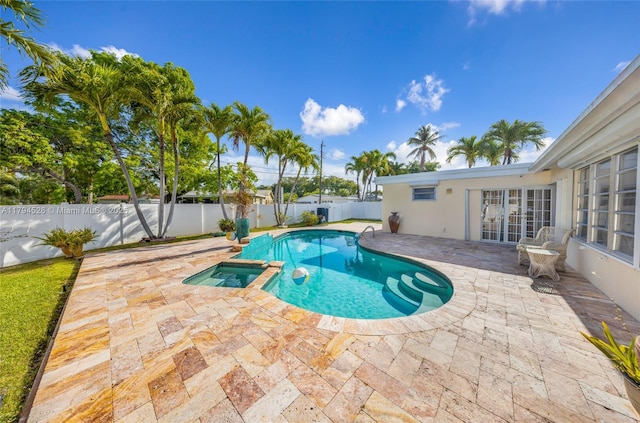 1243 Funston St, Hollywood, FL 33019 - view of swimming pool with a fenced backyard, a patio, french doors, and a pool with connected hot tub