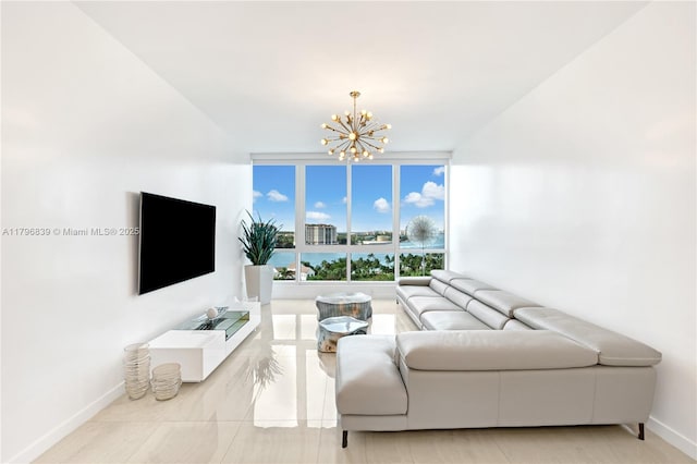 living room with baseboards and an inviting chandelier