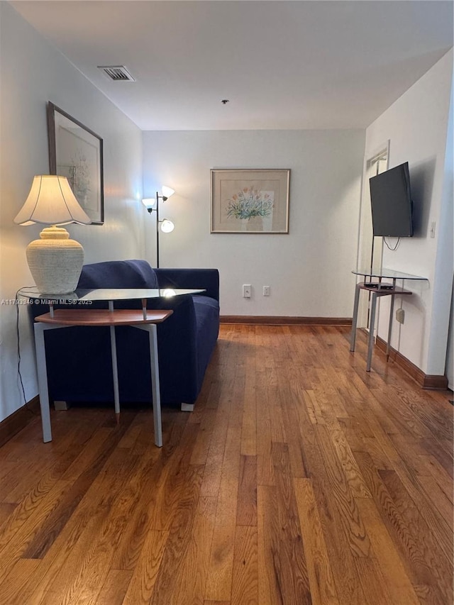 361 Collins Ave Unit A2, Miami Beach, FL 33139 - living area with visible vents, baseboards, and hardwood / wood-style flooring