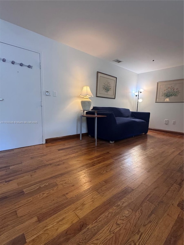 361 Collins Ave Unit A2, Miami Beach, FL 33139 - living room featuring baseboards, visible vents, and wood finished floors