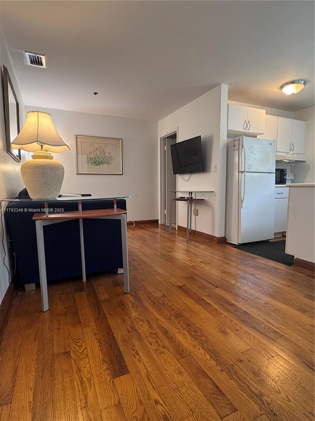 361 Collins Ave Unit A2, Miami Beach, FL 33139 - living room featuring dark wood finished floors, visible vents, and baseboards