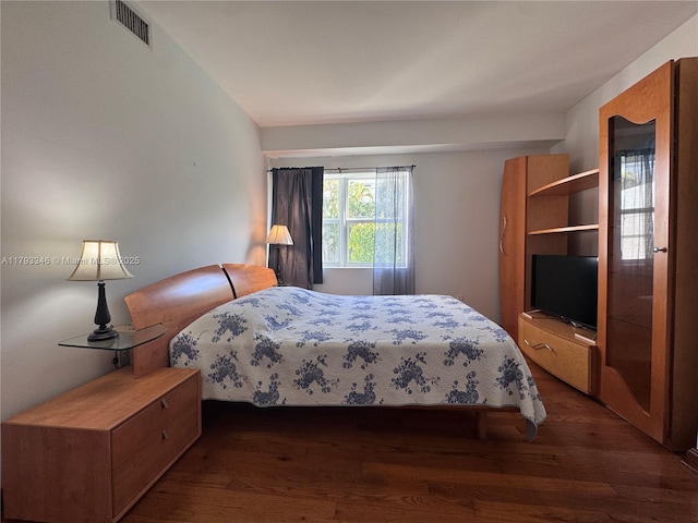 361 Collins Ave Unit A2, Miami Beach, FL 33139 - bedroom with dark wood-type flooring and visible vents