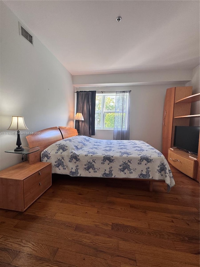 361 Collins Ave Unit A2, Miami Beach, FL 33139 - bedroom featuring visible vents and wood finished floors