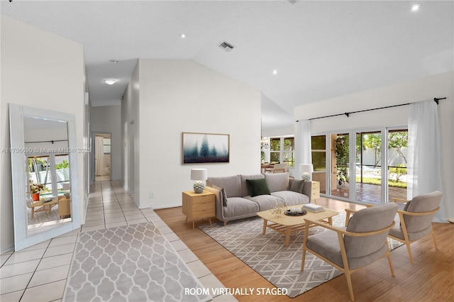 15941 Cobblestone Ct, Davie, FL 33331 - living area featuring high vaulted ceiling, light wood-type flooring, baseboards, and recessed lighting