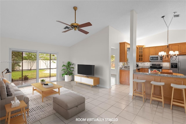 15941 Cobblestone Ct, Davie, FL 33331 - living room with high vaulted ceiling, a chandelier, a ceiling fan, and light tile patterned floors