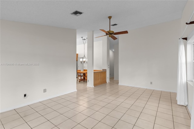 15941 Cobblestone Ct, Davie, FL 33331 - empty room featuring a chandelier, ceiling fan, high vaulted ceiling, and light tile patterned floors