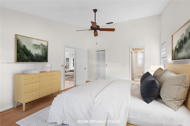 15941 Cobblestone Ct, Davie, FL 33331 - bedroom featuring a heating unit, wood finished floors, a high ceiling, connected bathroom, and a ceiling fan
