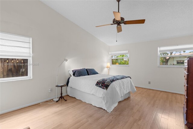 15941 Cobblestone Ct, Davie, FL 33331 - bedroom featuring light wood finished floors, vaulted ceiling, and ceiling fan
