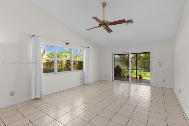 spare room with baseboards, visible vents, ceiling fan, light tile patterned flooring, and high vaulted ceiling
