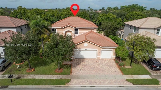 4528 SW 183rd Ave, Miramar, FL 33029 - mediterranean / spanish home with driveway, stucco siding, a tile roof, and a garage