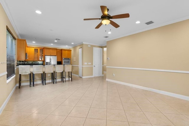 4528 SW 183rd Ave, Miramar, FL 33029 - kitchen featuring a peninsula, stainless steel appliances, brown cabinets, a breakfast bar area, and recessed lighting