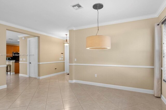 4528 SW 183rd Ave, Miramar, FL 33029 - spare room featuring crown molding, light tile patterned floors, visible vents, and baseboards