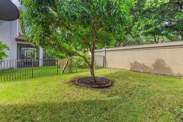 4528 SW 183rd Ave, Miramar, FL 33029 - view of yard featuring a fenced backyard and a sunroom