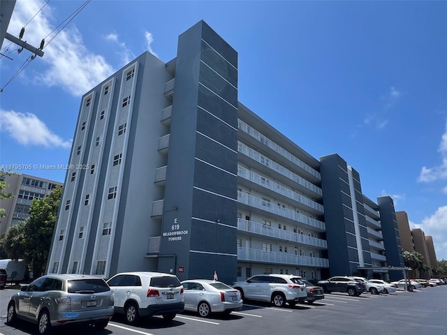 619 NE 14th Ave Unit 507, Hallandale Beach, FL 33009 - view of building exterior with uncovered parking