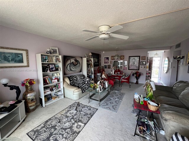 619 NE 14th Ave Unit 507, Hallandale Beach, FL 33009 - living area featuring carpet floors, a ceiling fan, and a textured ceiling