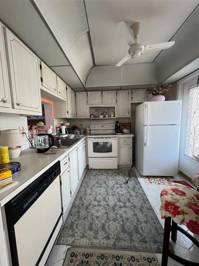 619 NE 14th Ave Unit 507, Hallandale Beach, FL 33009 - kitchen featuring white appliances, open shelves, light countertops, vaulted ceiling, and ceiling fan