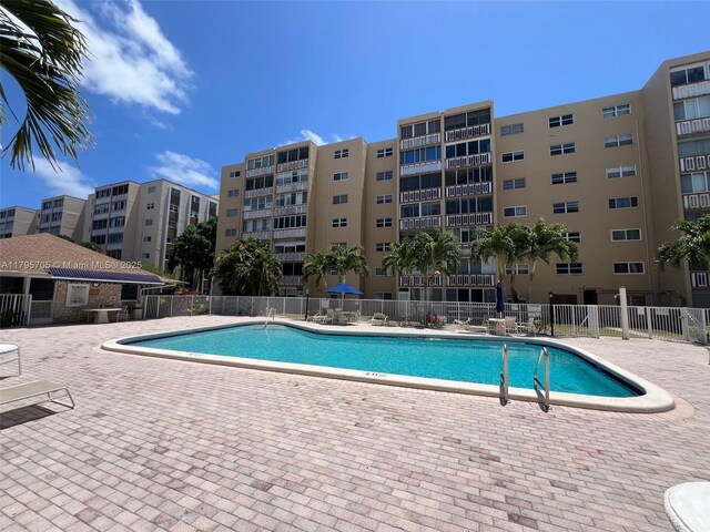 619 NE 14th Ave Unit 507, Hallandale Beach, FL 33009 - community pool with a patio area
