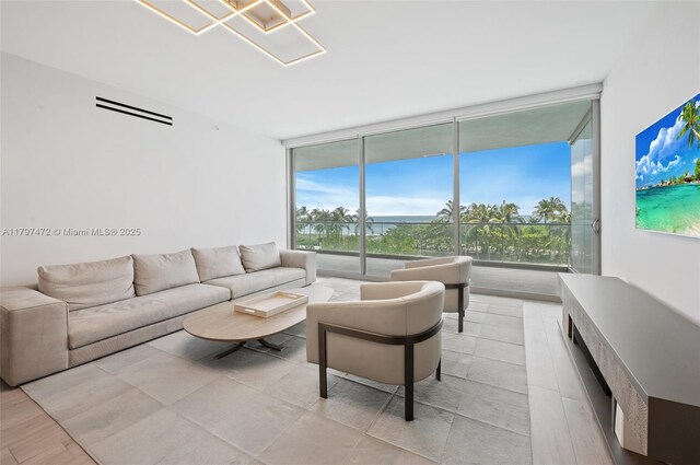 10201 Collins Ave Unit 303, Bal Harbour, FL 33154 - living area with expansive windows and healthy amount of natural light