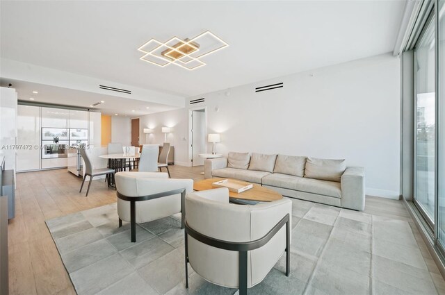 10201 Collins Ave Unit 303, Bal Harbour, FL 33154 - living area with light wood finished floors