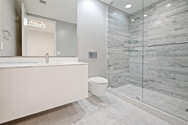 10201 Collins Ave Unit 303, Bal Harbour, FL 33154 - full bath with marble finish flooring, a stall shower, toilet, and vanity