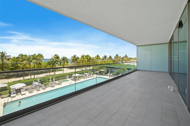 10201 Collins Ave Unit 303, Bal Harbour, FL 33154 - balcony with view of pool area and an in-ground hot tub