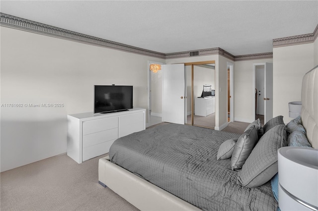bedroom featuring a closet, visible vents, and carpet floors