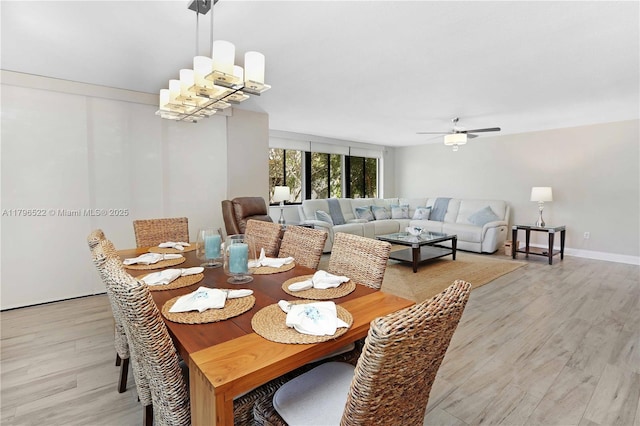 dining space featuring light wood-type flooring and ceiling fan