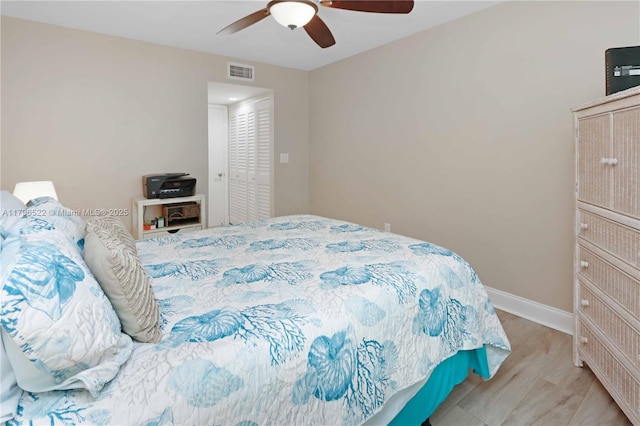 bedroom with visible vents, baseboards, and a ceiling fan