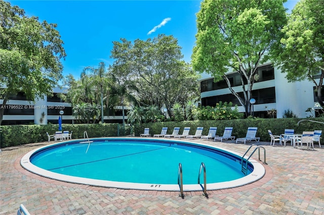 pool featuring a patio area