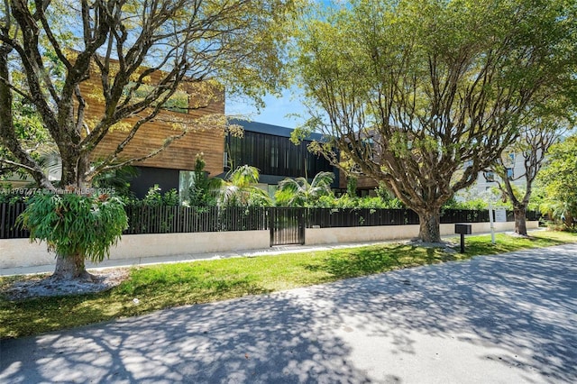 3101 Jefferson St, Miami, FL 33133 - view of property exterior with a fenced front yard