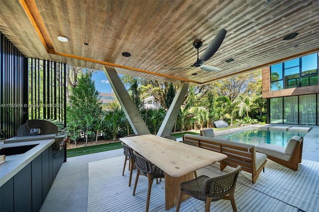 3101 Jefferson St, Miami, FL 33133 - view of patio with a ceiling fan, exterior kitchen, area for grilling, outdoor dining area, and an outdoor pool