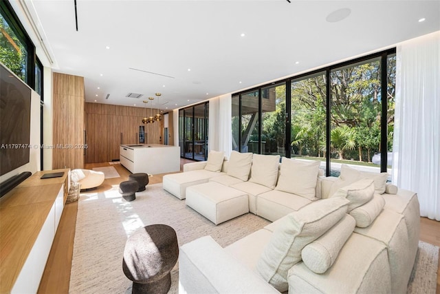 3101 Jefferson St, Miami, FL 33133 - living area featuring a healthy amount of sunlight, light wood finished floors, and floor to ceiling windows