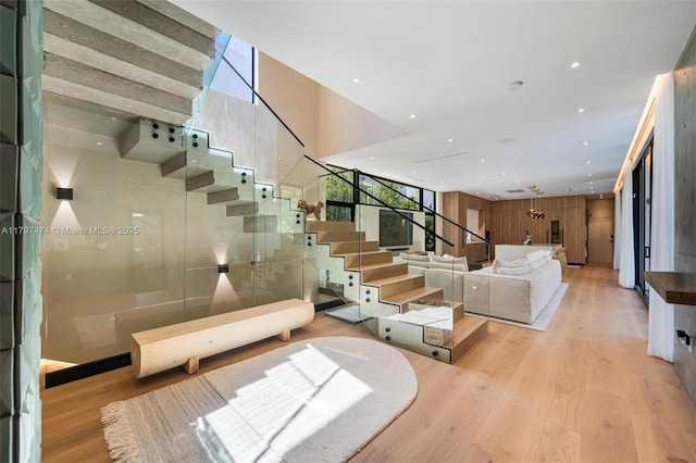 3101 Jefferson St, Miami, FL 33133 - staircase with a wall of windows, a healthy amount of sunlight, and wood finished floors