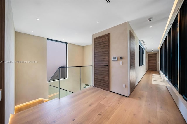 3101 Jefferson St, Miami, FL 33133 - corridor with recessed lighting, an upstairs landing, and wood finished floors