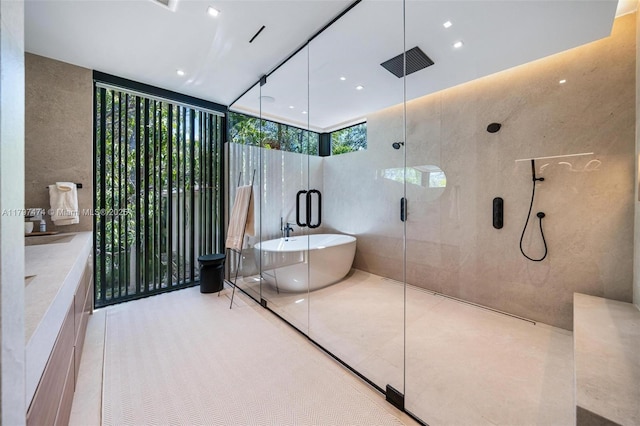 3101 Jefferson St, Miami, FL 33133 - full bathroom featuring a shower stall, recessed lighting, a freestanding bath, and floor to ceiling windows