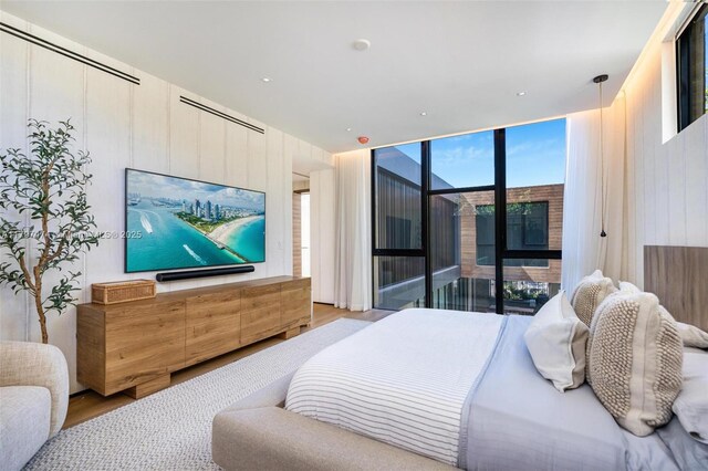 3101 Jefferson St, Miami, FL 33133 - bedroom with a wall of windows and wood finished floors
