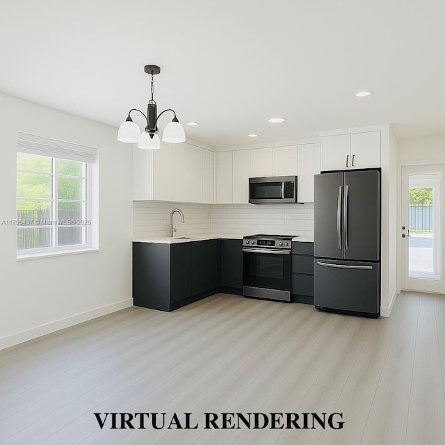 1900 SW 24th St, Miami, FL 33145 - kitchen with appliances with stainless steel finishes, light countertops, a sink, a chandelier, and tasteful backsplash